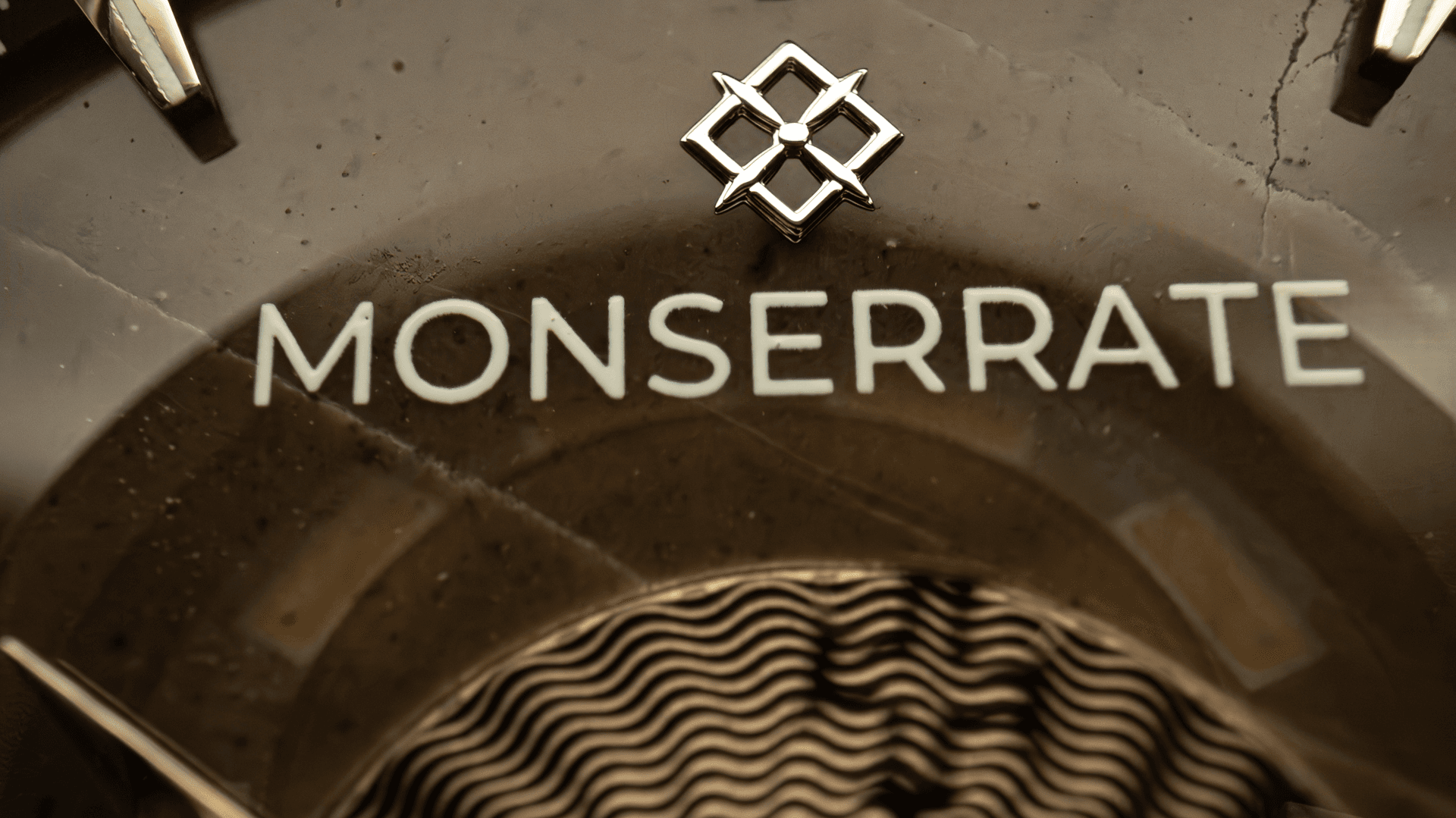 Monserrate brand mark macro detail